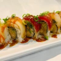 **Raider's Roll · Shrimp tempura, cucumber, jalapeño, tuna, escolar, hamachi, salmon, sesame seed. Green onion...
