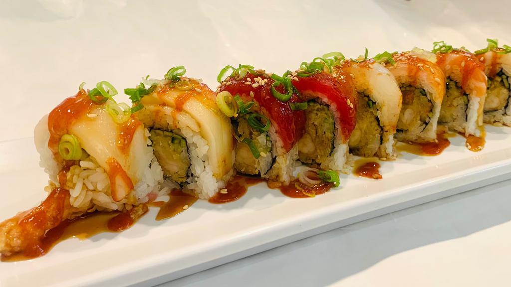 **Raider's Roll · Shrimp tempura, cucumber, jalapeño, tuna, escolar, hamachi, salmon, sesame seed. Green onion, with spicy sauce.