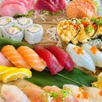 **TGI Omakase B(Sushi-Bar) for 2 People · 12 pieces of sashimi, 16 pieces of nigiri, California roll, dynamite roll, 2 soups, and 2 sa...