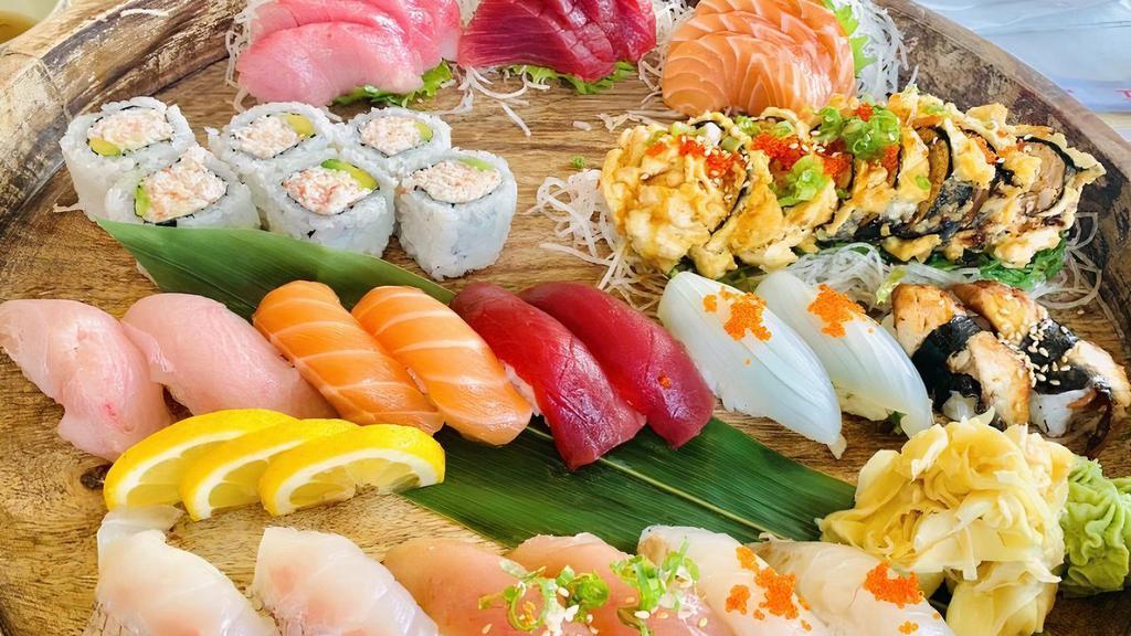 **TGI Omakase B(Sushi-Bar) for 2 People · 12 pieces of sashimi, 16 pieces of nigiri, California roll, dynamite roll, 2 soups, and 2 salads.