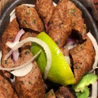 Seekh Kabab · Minced lamb mixed with herbs and spices, then cooked in clay oven.