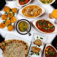 Clay Oven Thali for Two · Papadum, Tandoori Chicken, Nan, Vegetable Samosa, Boti Kabab, Rice, Raita, Chicken Tika Masa...