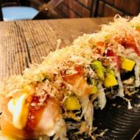 Yoji Kanro Roll · Mango, Eel, Avocado, Topped with Spicy Crab, Salmon, Tuna, Avocado, Tobiko, Scallions, Soy G...