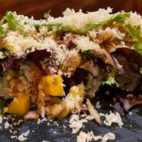 On The Fire Roll · Tempura shrimp and cucumber roll top with assorted fish, avocado, mango, onion and green sal...