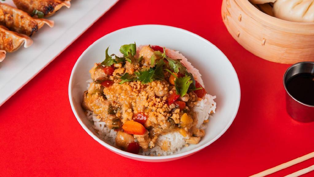Orange Chicken Bowl · Chicken in a sweet orange sauce with red peppers and candied orange peel, served on jasmine white rice.