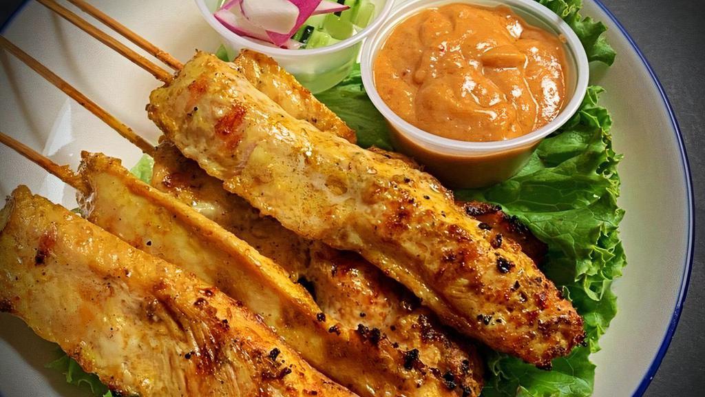 Satay สะเต๊ะ · Choice of chicken or tofu on skewers, marinated with curry powder and coconut milk grilled and served with peanut sauce and cucumber salad.