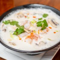 Tom Kha · Coconut milk soup with lemongrass, onion, galanga, and mushroom. Choice of chicken, prawns (...