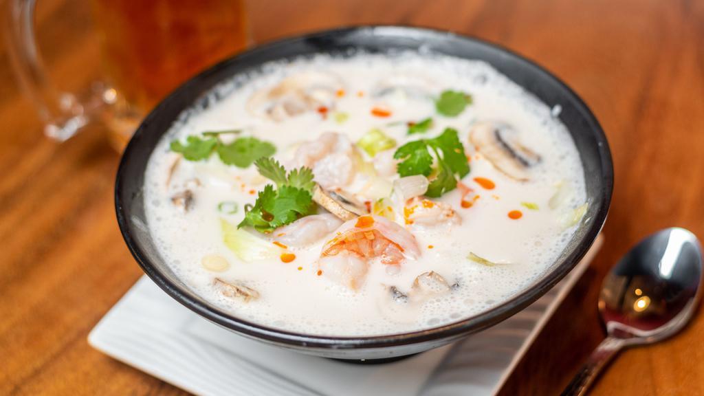 Tom Kha · Coconut milk soup with lemongrass, onion, galanga, and mushroom. Choice of chicken, prawns (for an additional charge), or vegetarian.