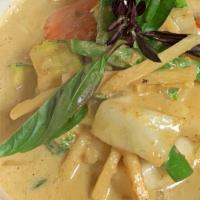 Green Curry · Green curry cooked with zucchini, green bean, bamboo shoot, basil and bell pepper and your c...