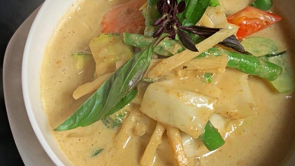 Green Curry · Green curry cooked with zucchini, green bean, bamboo shoot, basil and bell pepper and your choice of protein: chicken, pork, beef (for an additional charge), prawns (for an additional charge), or vegetarian.