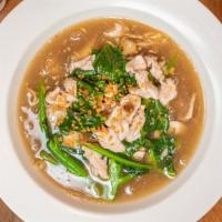 Rad Nah · Stir-fried flat rice noodle topped with Chinese broccoli in light gravy, and your choice of ...