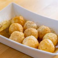 Curry Fish Balls · 9 pieces of deep fried fish ball with curry sauce.