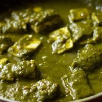 Palak Paneer · Cottage cheese cooked w/blended Indian spices spinach sauce.