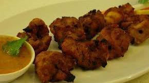 Chicken Sukka · Boneless chicken cooked with dry Indian spices on hot grill.