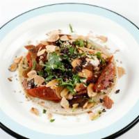 Roasted Rainbow Carrot Taco · Mama’s mole, smoky chipotle yogurt, sesame seed, almond, cilantro, and crispy quinoa. Includ...