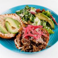 Carnitas Burger · Our Berkshire pork carnitas on a grilled brioche bun with chipotle aioli, cortina, avocado a...
