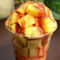 Regular Mangonada · Delicious mango ice cream with pieces of fresh mango topped off with chamoy and Tajin.