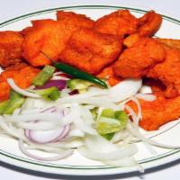 Fish 65 · Very crispy boneless fish fried with a touch of exotic spices.