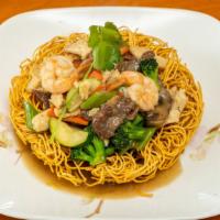 Stir-fry Crispy Egg Noodle /  Mì Xào Giòn Chay · (Mixed vegetables, tofu stir-fried in chef's special vegetarian sauce, served on top of cris...