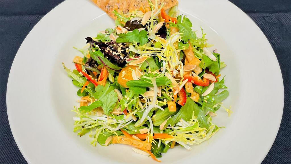 Ginger Sesame Salad · Organic baby greens. julienne vegetables, crisp wontons, mandarin oranges, toasted almonds, sesame seeds, cilantro, ginger sesame dressing. 450 cal