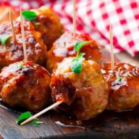 Meatballs · Four pieces of extravagant italian-styled juicy meatballs with side of marinara sauce.