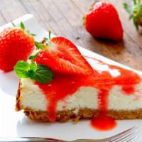 Strawberry Cheesecake · Elegant-tasty slice of cheesecake topped with cut strawberries.