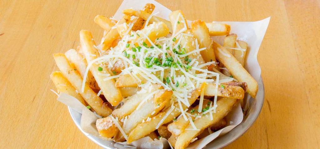 Truffle Fries · Tossed in white truffle oil and Grana Padano, Chives.