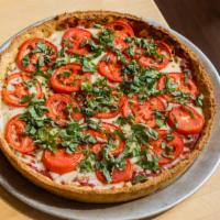 The Margherita (Large) · Vegetarian. Pizza Sauce, Fresh Roma tomatoes, basil, and garlic. A pizza so lite it defies g...