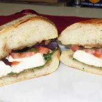 The Loop Sandwich · Vegetarian. Fresh mozzarella cheese, topped with Roma tomatoes, fresh cut basil, spring mix,...