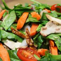 Spinach Salad · Vegetarian. Vegan. Fresh spinach leaves mixed with red onions, artichoke hearts, button mush...