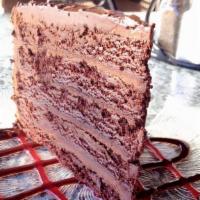 Chocolate Cake · Vegetarian. Dark chocolate cake with a creamy chocolate filling and topped with chocolate ga...