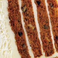 Carrot Cake · Vegetarian. Four layers of moist carrot cake filled with raisins, walnuts, and pineapple, to...