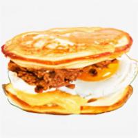 Cheesy Egg & Cheese Pancake Sandwich · Your choice of meat, scrambled egg, cheddar and Swiss cheese between two pancakes and served...