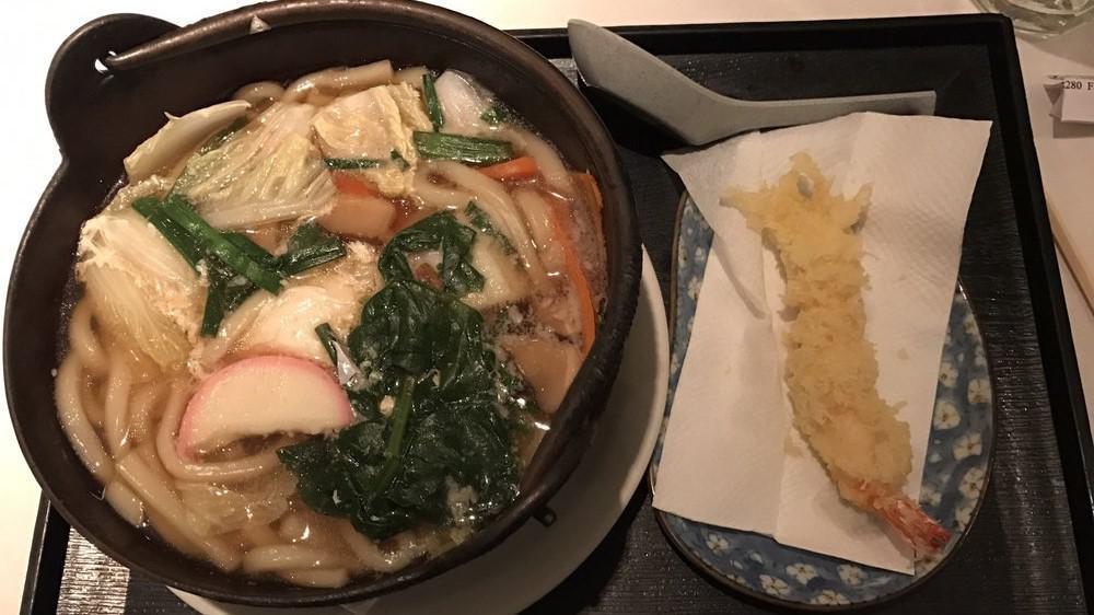 Nabeyaki Udon and Soba · Hot thick  and  buckwheat noodle soup with shrimp tempura, egg, chicken & mushroom served in a cast iron bowl.
