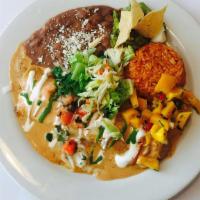 Enchiladas De Mariscos · Grilled seafood marinated in adobo sauce, wrapped in a flour tortilla with a chipotle tequil...