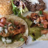 Taco · Choice of chicken, al pastor or chile verde, topped with salsa, onions cilantro and served w...