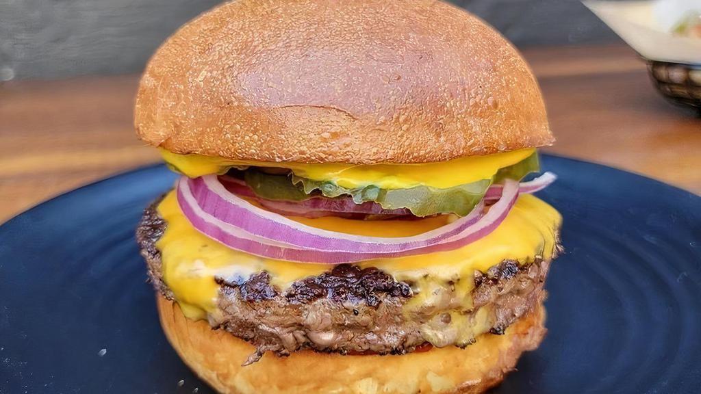 THE CLASSIC · 1/2 lb Wagyu Beef Patty, Double American Cheese, Red Onions, Pickles, Ketchup,  Mayonnaise, Yellow Mustard