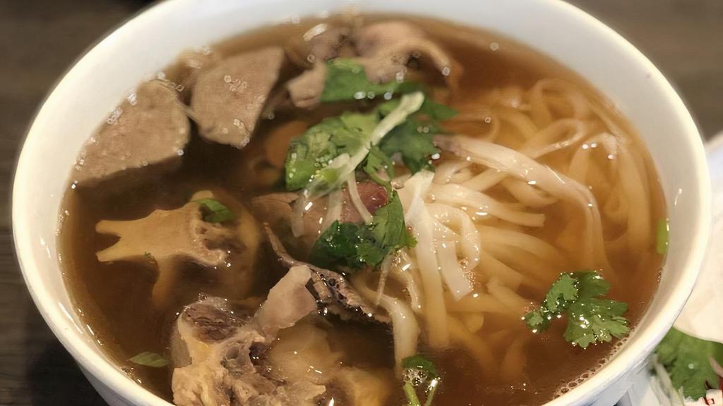 14. Oxtail Phở Dac Biet · special combination with oxtail.

* Consuming raw or undercooked meats, poultry, seafood, shellfish or eggs may increase your risk of foodborne illness.