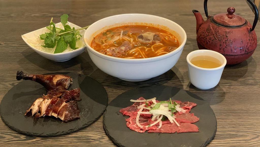 23. Bun Bo Hue · spicy beef noodle soup, served with thin vermicelli.

* Consuming raw or undercooked meats, poultry, seafood, shellfish or eggs may increase your risk of foodborne illness.