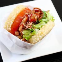 Bbq Chicken Koja · Korean BBQ chicken, sesame vinaigrette lettuce, tomato, cilantro, spicy gochujang sauce, ses...