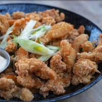 Popcorn Chicken · Tender bites of fried chicken seasoned with Burmese spices served with Burmese pickles (cala...
