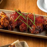 Sweet Chili Wings · Delicious, fried chicken wings served with Sweet Chili Glaze flavor