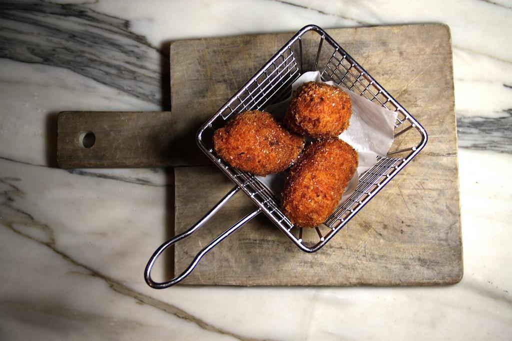 Suppli · Traditional roman style risotto croquettes stuffed with smoked provola cheese