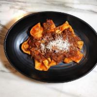 Coda Alla Vaccinara · Homemade pappardelle pasta served with slowly braised Oxtail ragu in tomato sauce and Pecori...