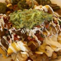 Mega Fuego Nachos - Chips · For 2-4 people appetizer or big dinner. Crispy home-made tortilla chips, melted cheese on to...