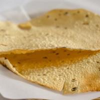 Papadam · Delicate and crispy sun dried lentil wafers.