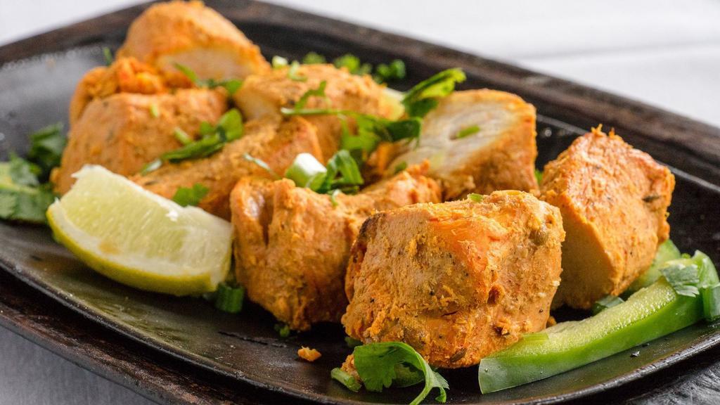 Chicken Tikka Kabab · Boneless chicken cubes marinated in spices and roasted.