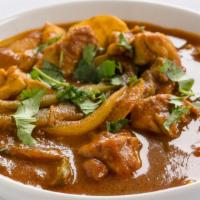 Chicken Curry · Boneless chicken cooked in Feng, ginger, garlic, tomato and based gravy.