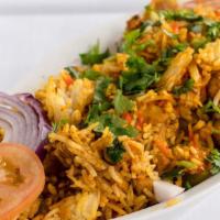 Chicken Biryani · Indian basmati rice cooked with chicken, nuts and spices.