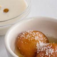 Gulab Jamun · Fried Indian cheese ball in a syrup of rose water & sugar.